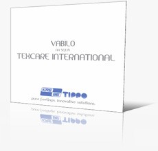 Belo vabilo na sejem Texcare International z logotipom podjetja Krebe Tippo.